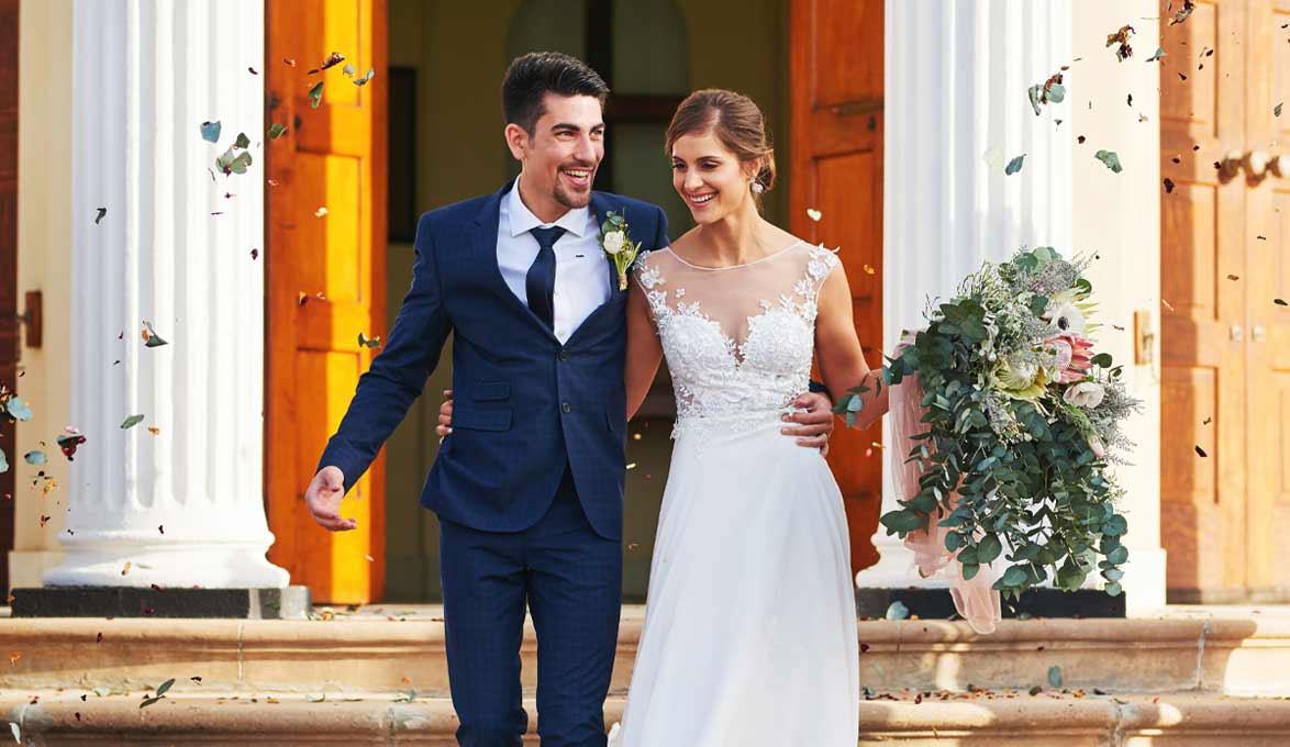 Couple that just go married leaving the chapel.